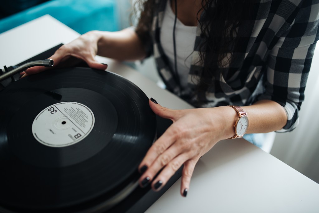 Vinyl record playing on a turntable in a bright interior